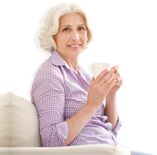 elderly woman holding cup of coffee